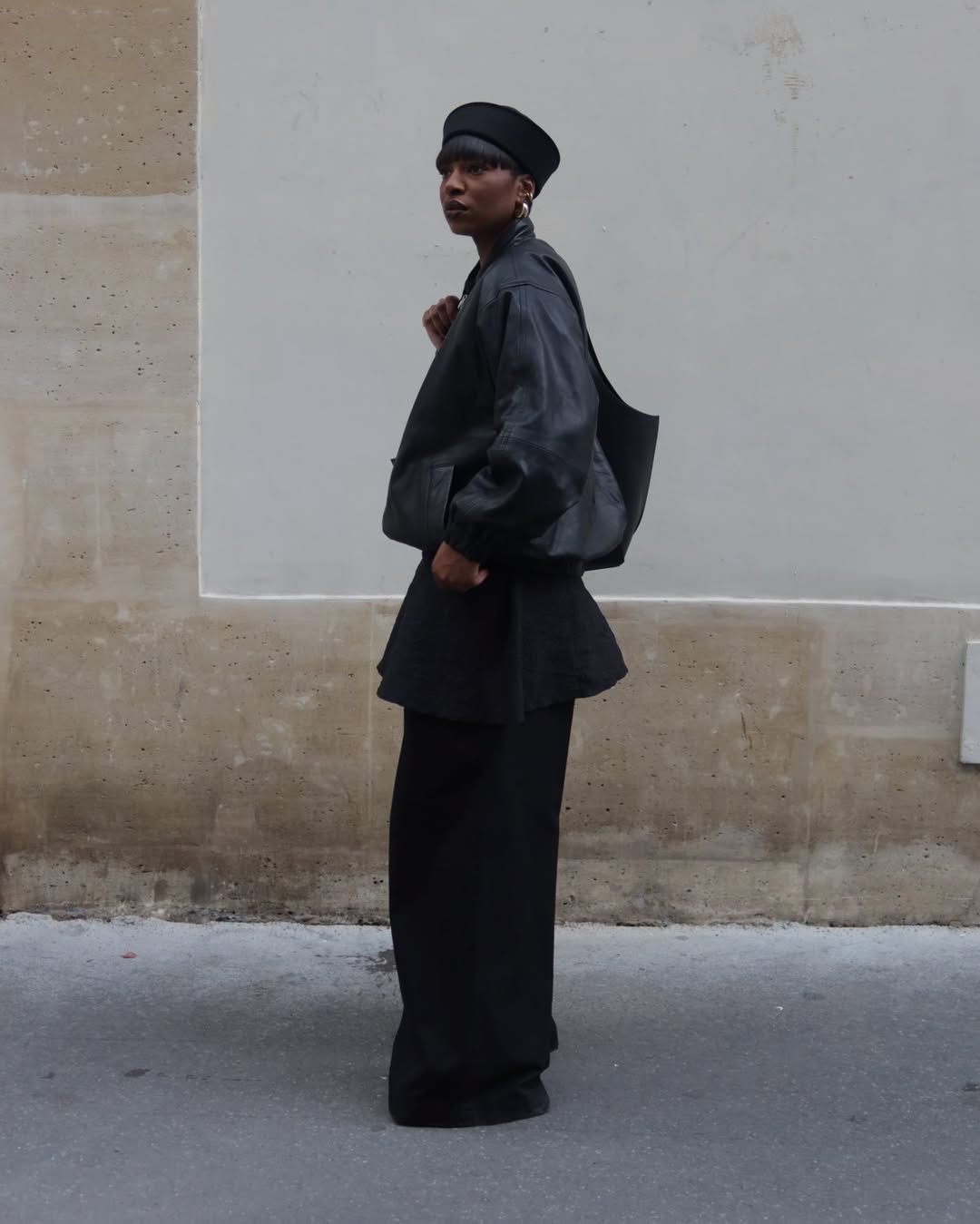 Loika wears a pillbox hat