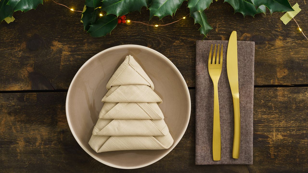 Napkin folded into Christmas tree shape