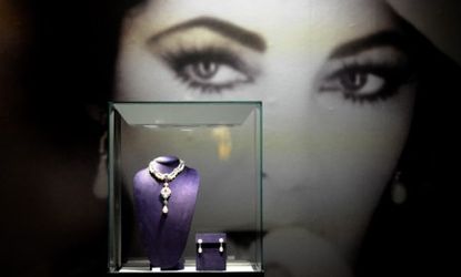 Elizabeth Taylor's La Peregrina necklace, which features a rare 50.6 carat pearl, sold for $11.8 million Tuesday.