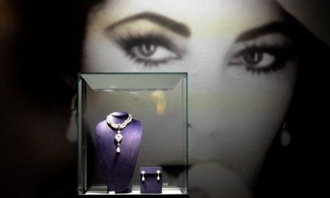 Elizabeth Taylor&amp;#039;s La Peregrina necklace, which features a rare 50.6 carat pearl, sold for $11.8 million Tuesday.