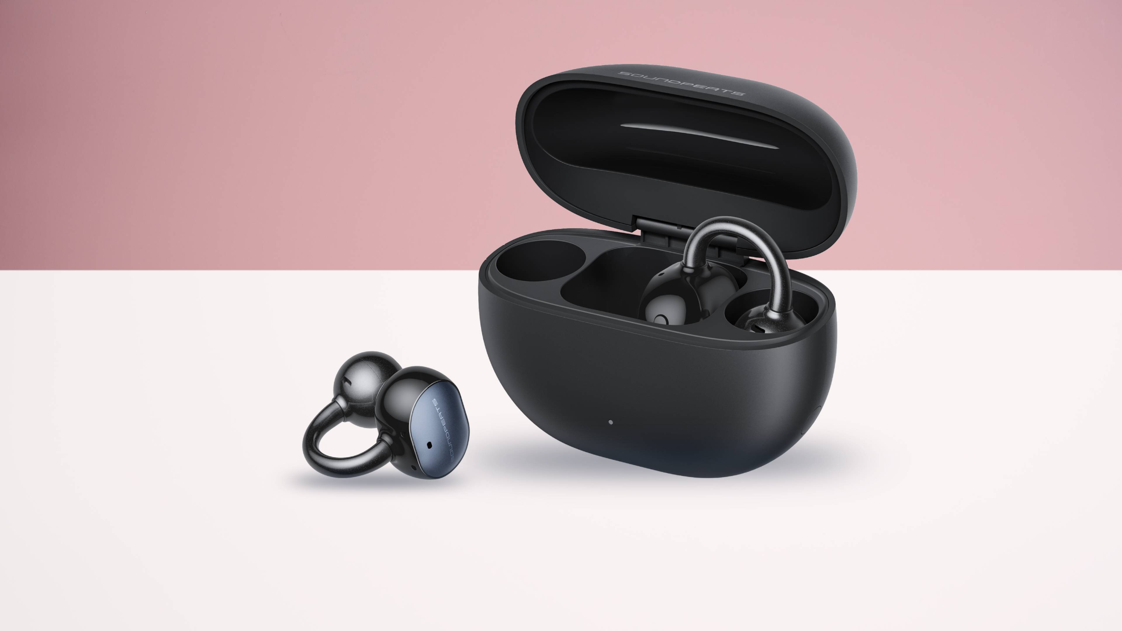 Soundpeats UU2 earbuds and case in black, on white and pink TR background