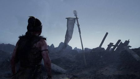 Senua's Saga Hellblade 2 Senua looking at banner with red icon