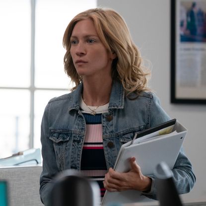 brittany snow as mandy matney walking through a newsroom in murdaugh death in the family