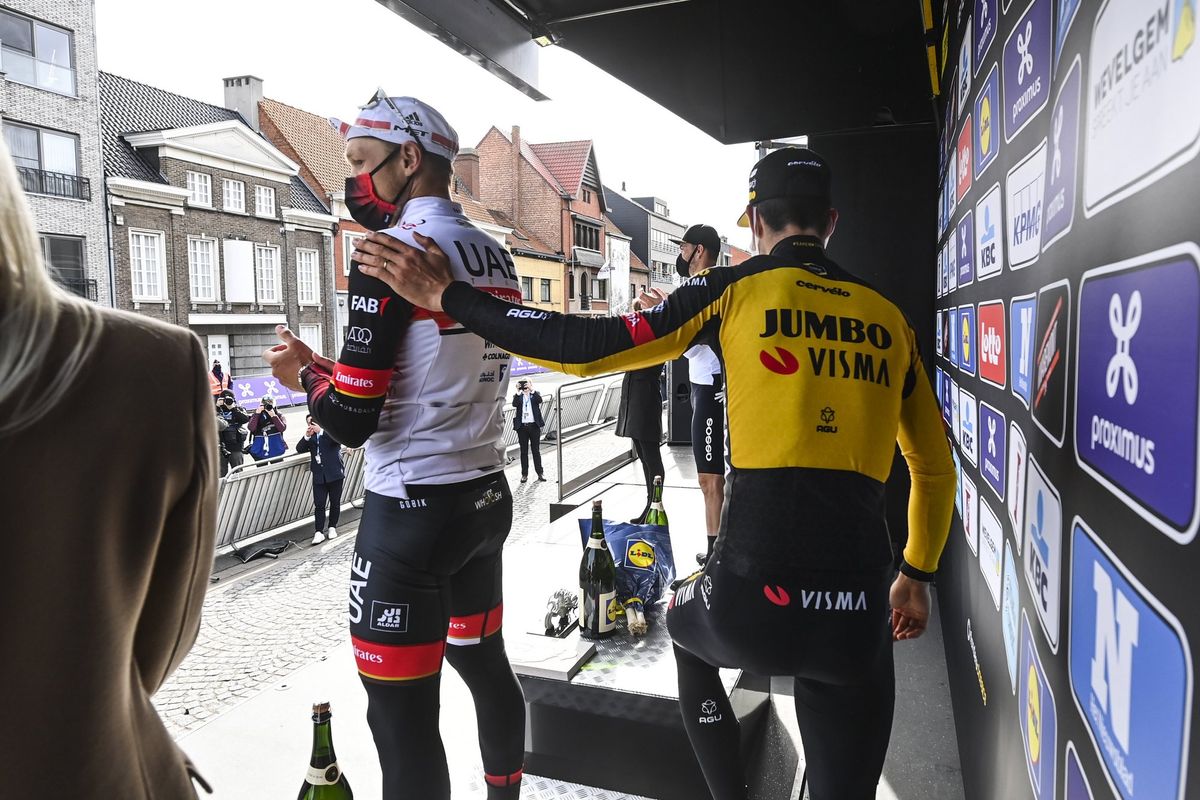 Matteo Trentin (UAE Team Emirates) gets a pat on the back from Wout van Aert (Jumbo-Visma) after finishing third at Gent-Wevelgem