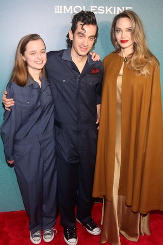 Vivienne Jolie-Pitt, Justin Levine and Angelina Jolie attend the opening night of "The Outsiders" at The Bernard B. Jacobs Theatre on April 11, 2024 in New York City