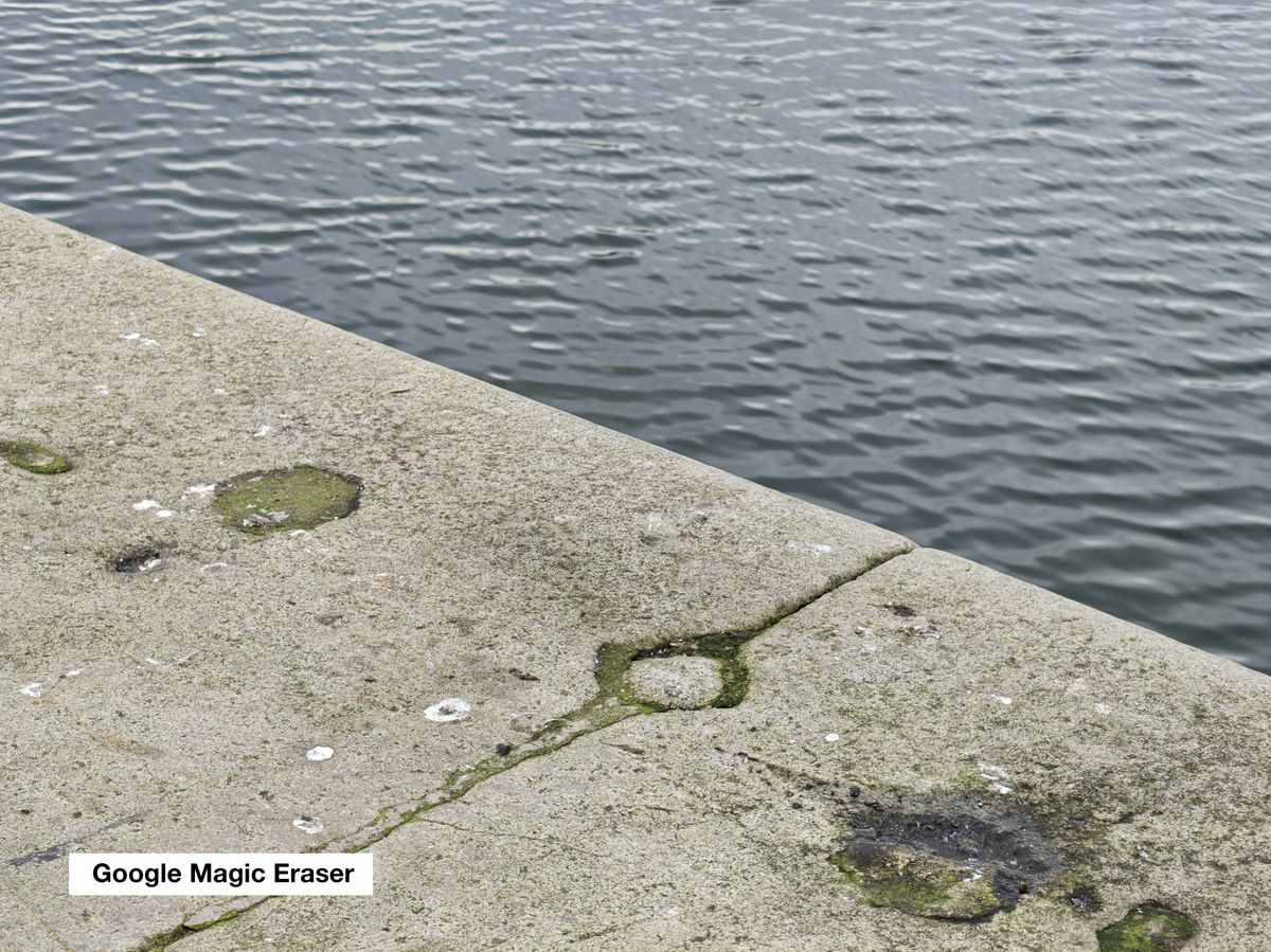 A stone wall near some water