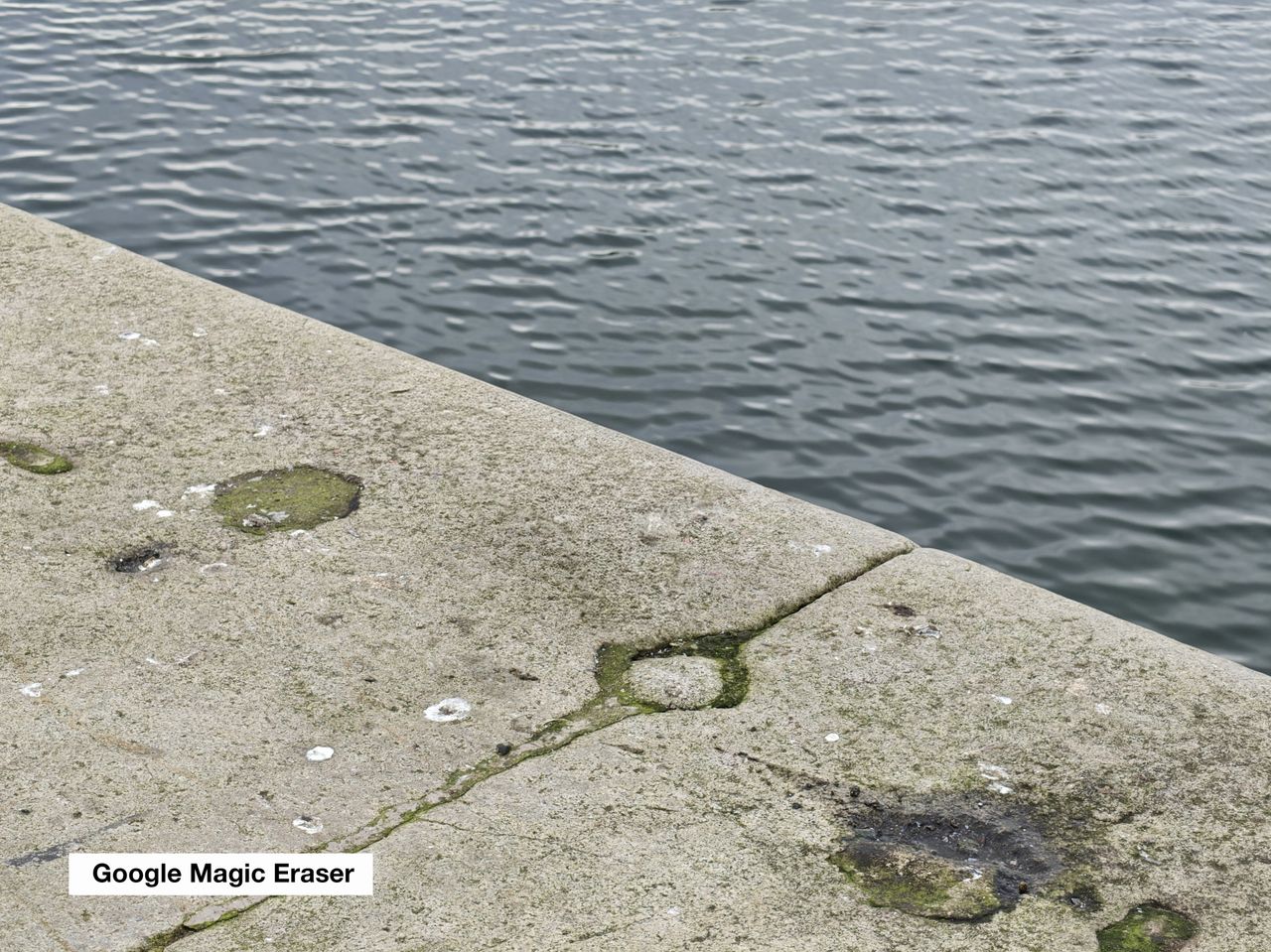 A stone wall near some water