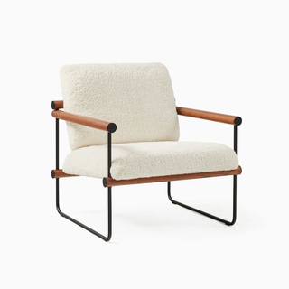 mid-century modern chair with wood frame and white fuzzy cushion