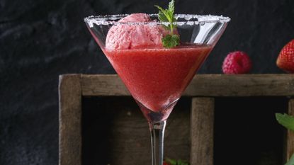 Close up picture of Sicilian cocktail with a scoop of sorbet in a martini glass