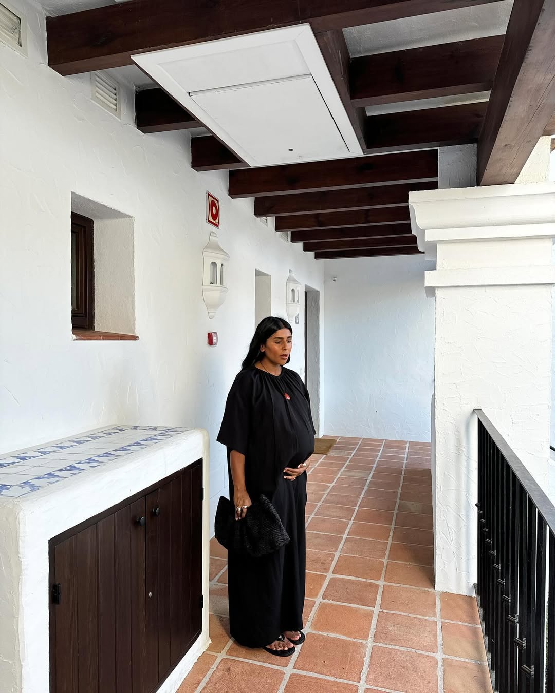 @monikh wearing a black dress