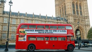 Bus outside Parliament with Burger King ad