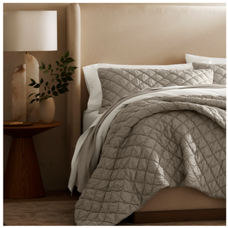 A quilted handstitched cloud comforter set in Pewter from Boll & Branch