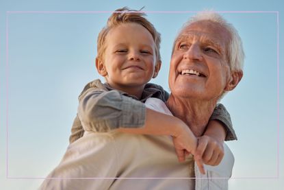 Grandfather carrying grandson on his back