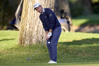 Edoardo Molinari hits a chip shot