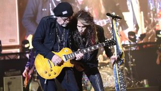 Brad Whitford (left) and Steven Tyler of Aerosmith perform live in 2019