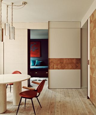 Room divider with wall panels and sliding door