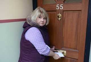 Aunt Babe posting a letter through the letter box of number 55