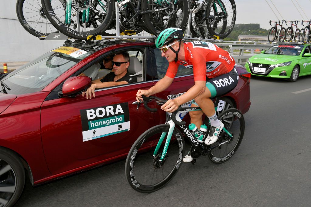 NANNING CHINA OCTOBER 19 Pascal Ackermann of Germany and Team BoraHansgrohe Red Leader Jersey Enrico Poitschke of Germany Sports Director of Team BoraHansgrohe during the 3rd Tour of Guangxi 2019 Stage 3 a 143km stage from Nanning to Nanning 83m TourofGuangxi on October 19 2019 in Nanning China Photo by Tim de WaeleGetty Images