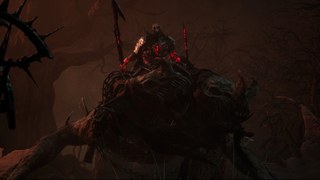 The Lightbearer, a boss from Lords of the Fallen, looms in front of the player with malice astride a two-headed drake.