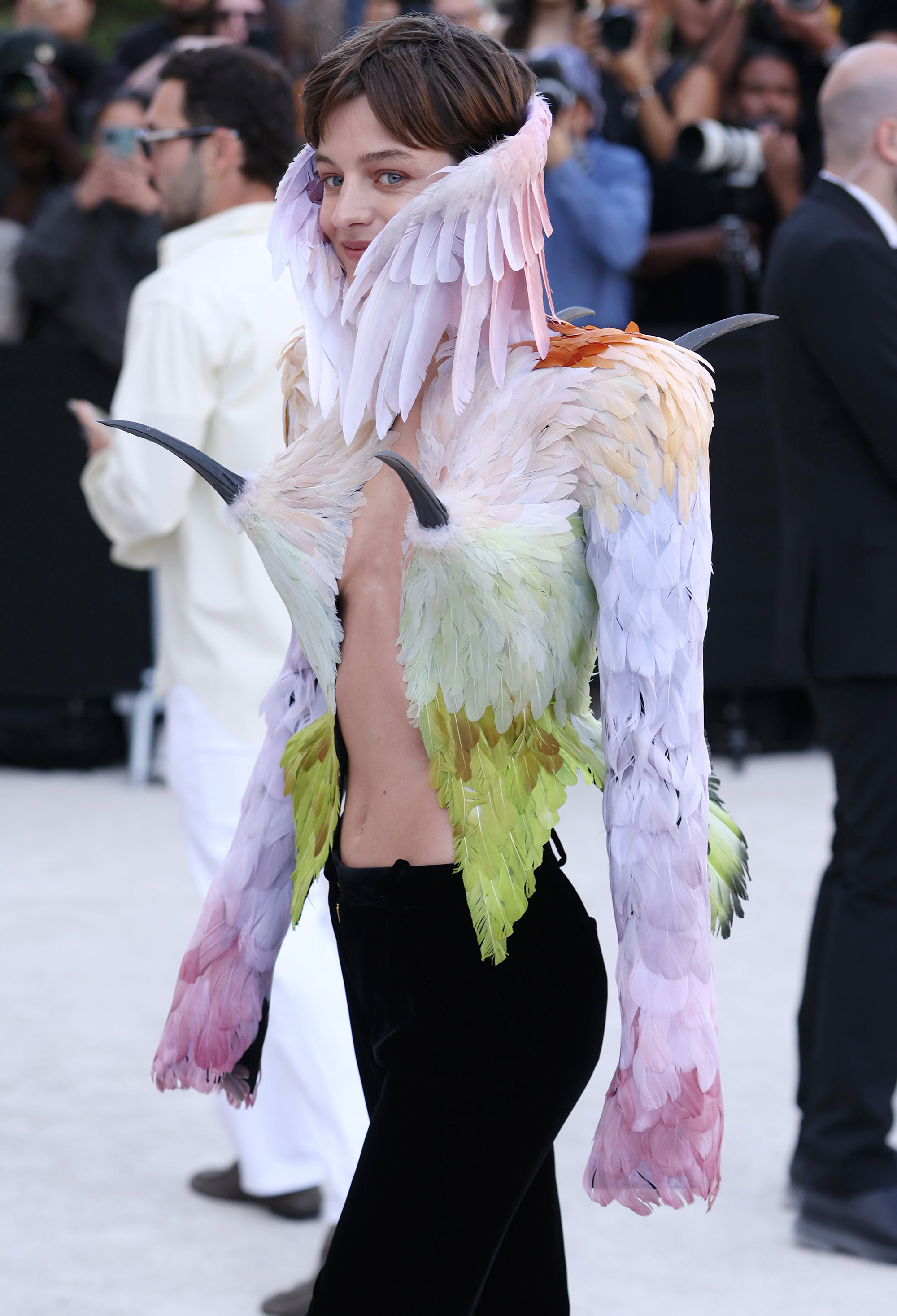 Emma Corrin in viral Schiaparelli bird blazer with beaks in breast area and wings around the neck. Fall/Winter 2026-2027