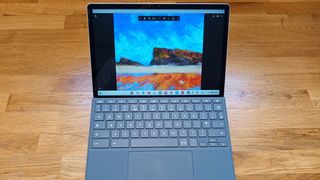 HP Chromebook X2 11 review; a photo of a tablet computer on a wooden table