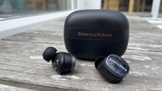 Bowers &amp; Wilkins Pi8 against grey wood background