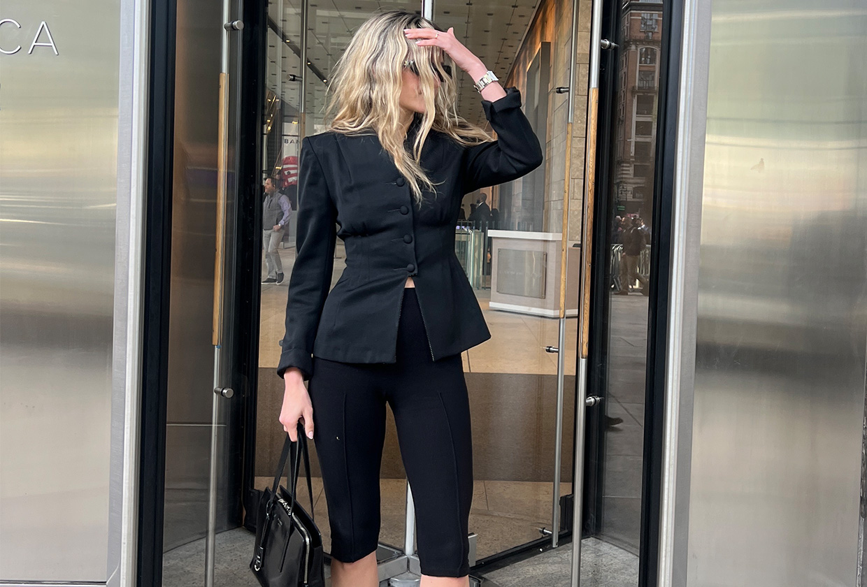 Eliza Huber wearing a fitted black blazer and black Donni capri pants.