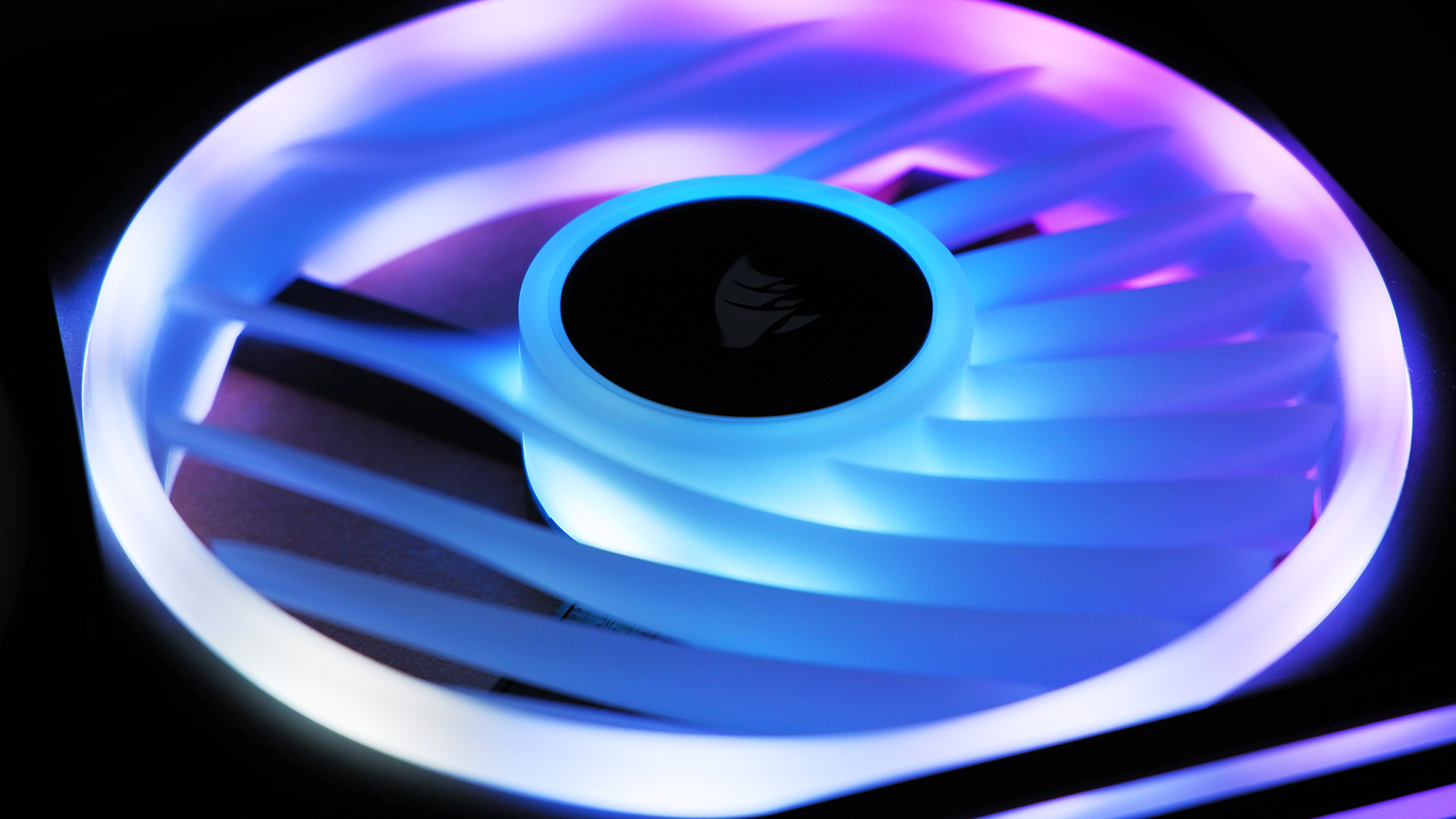 Corsair iCUE Link QX120 RGB setup on a desk.