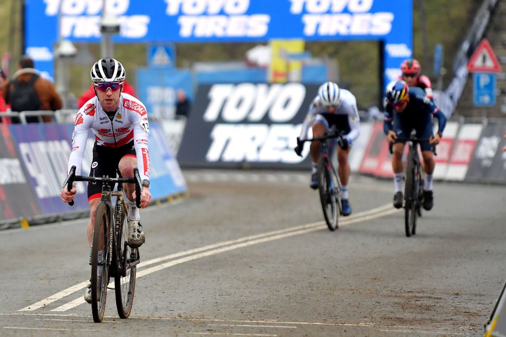 HOOGERHEIDE NETHERLANDS JANUARY 23 Eli Iserbyt of Belgium and Team Pauwels Sauzen Bingoal sprints to win ahead of Lars Van Der Haar of Netherlands and Team Baloise Trek Lions Thomas Pidcock of The United Kingdom and Team INEOS Grenadiers and Michael Vanthourenhout of Belgium and Team Pauwels Sauzen Bingoal during the 32nd GP Adrie Van der Poel Hoogerheide UCI CycloCross Worldcup 2022 Mens Elite CXWorldCup on January 23 2022 in Hoogerheide Netherlands Photo by Luc ClaessenGetty Images