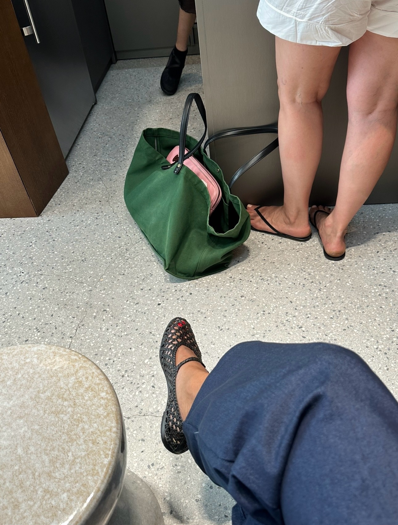 Creator @slipintostyle wearing black mesh ballet flats with a red pedicure
