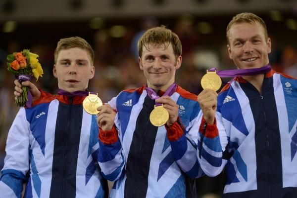Great Britain's team sprint squad show off their Olympic gold medals