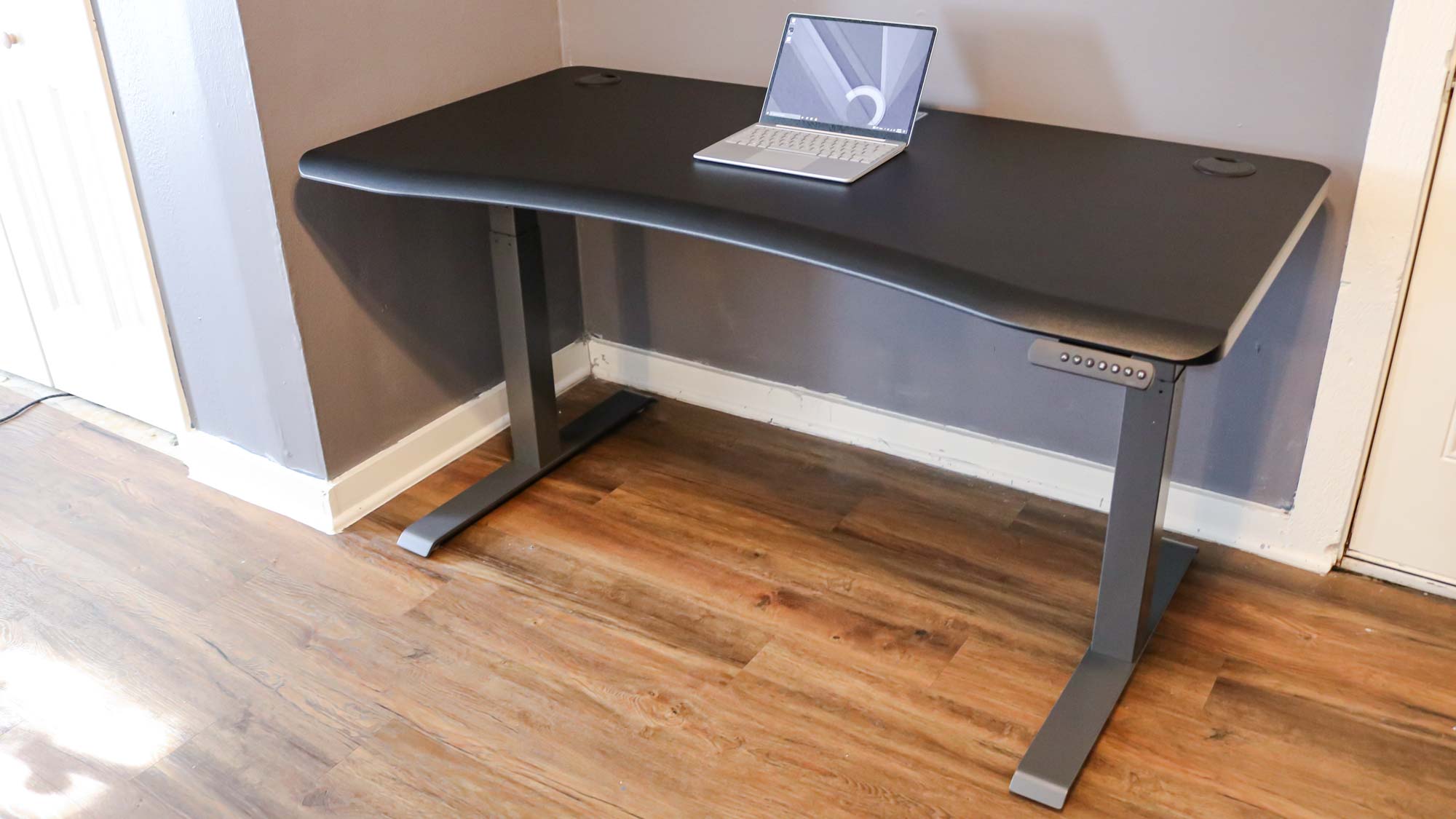 Vari Curve Electric Standing Desk laptop