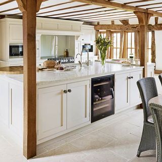 kitchen area with marble worktop and wooden beam
