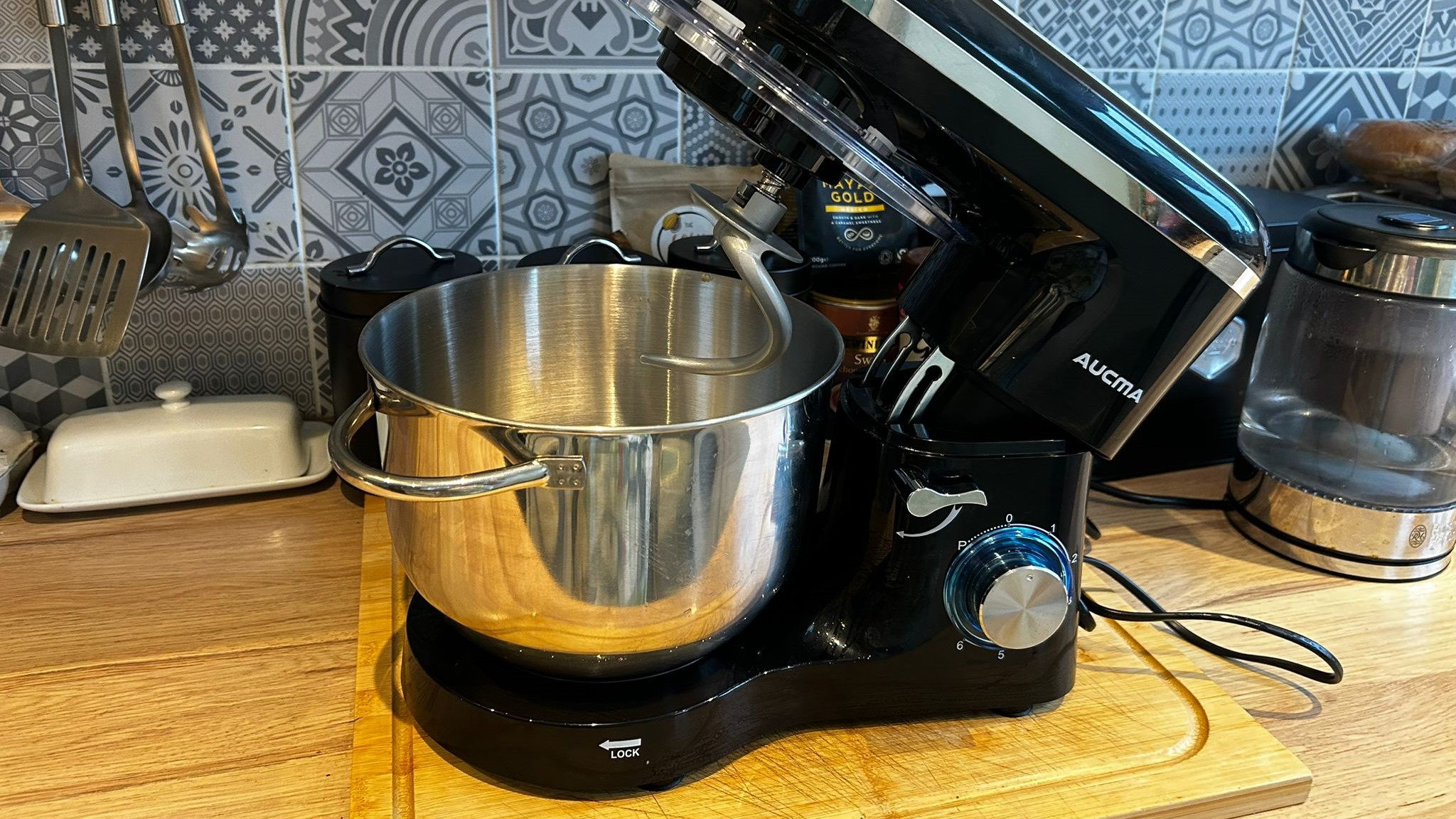 An Aucma stand mixer on a kitchen countertop