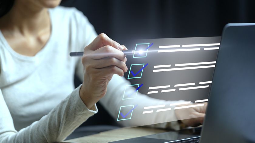 Person with a pen ticking illustrated check boxes.