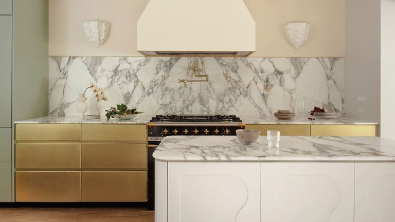 a kitchen island idea with shapes on in a brass kitchen