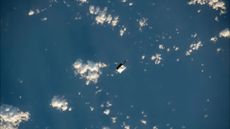 An astronaut tool bag dropped during a spacewalk can be seen orbiting Earth on Nov. 2, 2023.