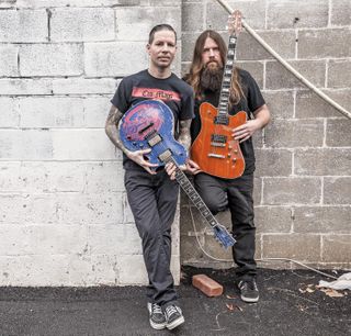 Willie Adler (left) with his signature ESP Warbird and Mark Morton with his signature Jackson Pro Series Dominion