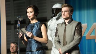 Jennifer Lawrence as Katniss and Josh Hutcherson as Peeta in Hunger Games: Catching Fire