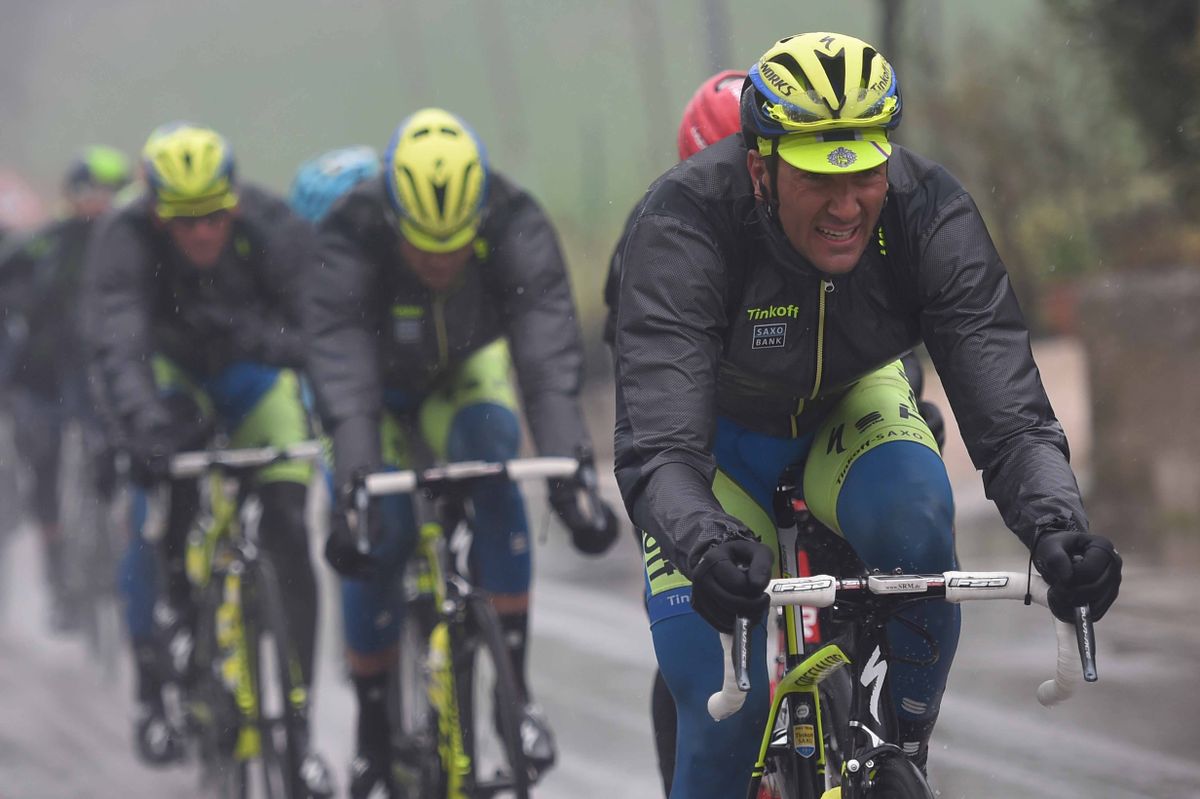 Ivan Basso (Tinkoff-Saxo) grimes in the rain