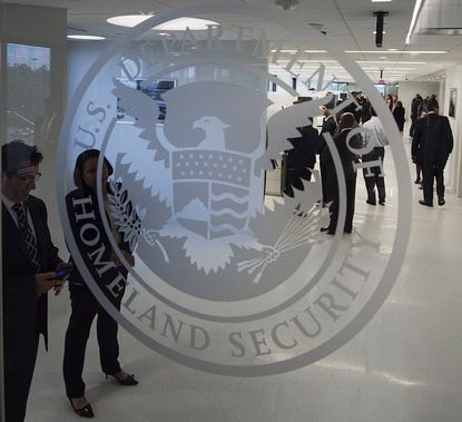 The US Department of Homeland Security logo at the ICE Cyber Crimes Center.