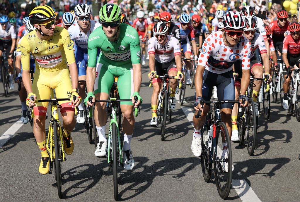 FRom L Team UAE Emirates rider Slovenias Tadej Pogacar wearing the overall leaders yellow jersey Team Deceuninck rider Irelands Sam Bennett wearing the best sprinters green jersey Team Ineos rider Ecuadors Richard Carapaz wearing the best climbers polka dot jersey ride during the 21st and last stage of the 107th edition of the Tour de France cycling race 122 km between ManteslaJolie and Champs Elysees Paris on September 20 2020 Photo by KENZO TRIBOUILLARD AFP Photo by KENZO TRIBOUILLARDAFP via Getty Images