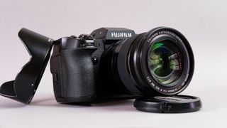 A photo of the Fujifilm X-H2S against a grey background.