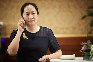 Huawei CFO Meng Wanzhuo chatting on the phone
