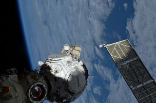 Cosmonauts Anton Shkaplerov (in foreground with red striped spacesuit) and Pyotr Dubrov of Roscosmos work outside Russia's Prichal multi-port docking module during a spacewalk outside of the International Space Station on Wednesday, Jan. 19, 2022.