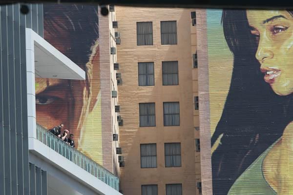 A police security detail overlooks LA Live, an entertainment district that also hosted professional hockey and basketball games today.