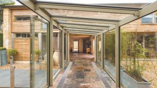 glass link in barn conversion with flagstone floors