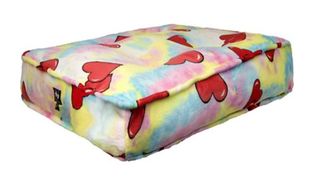 Multicolored dog bed with red hearts