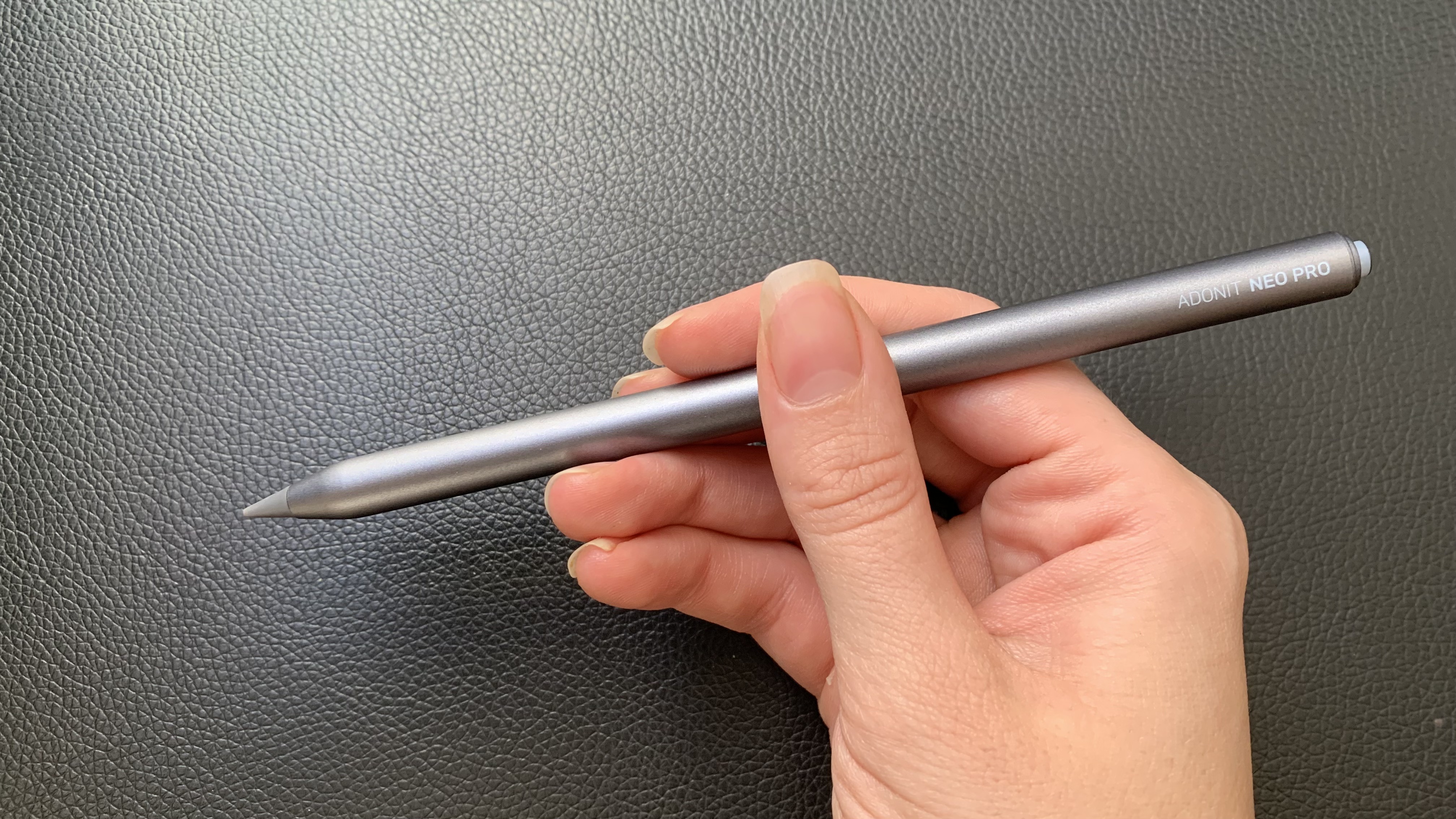 Adonit Neo Pro stylus being held in a hand