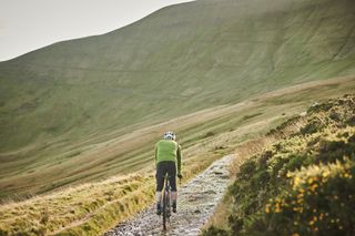 Image shows a cyclist gravel riding.